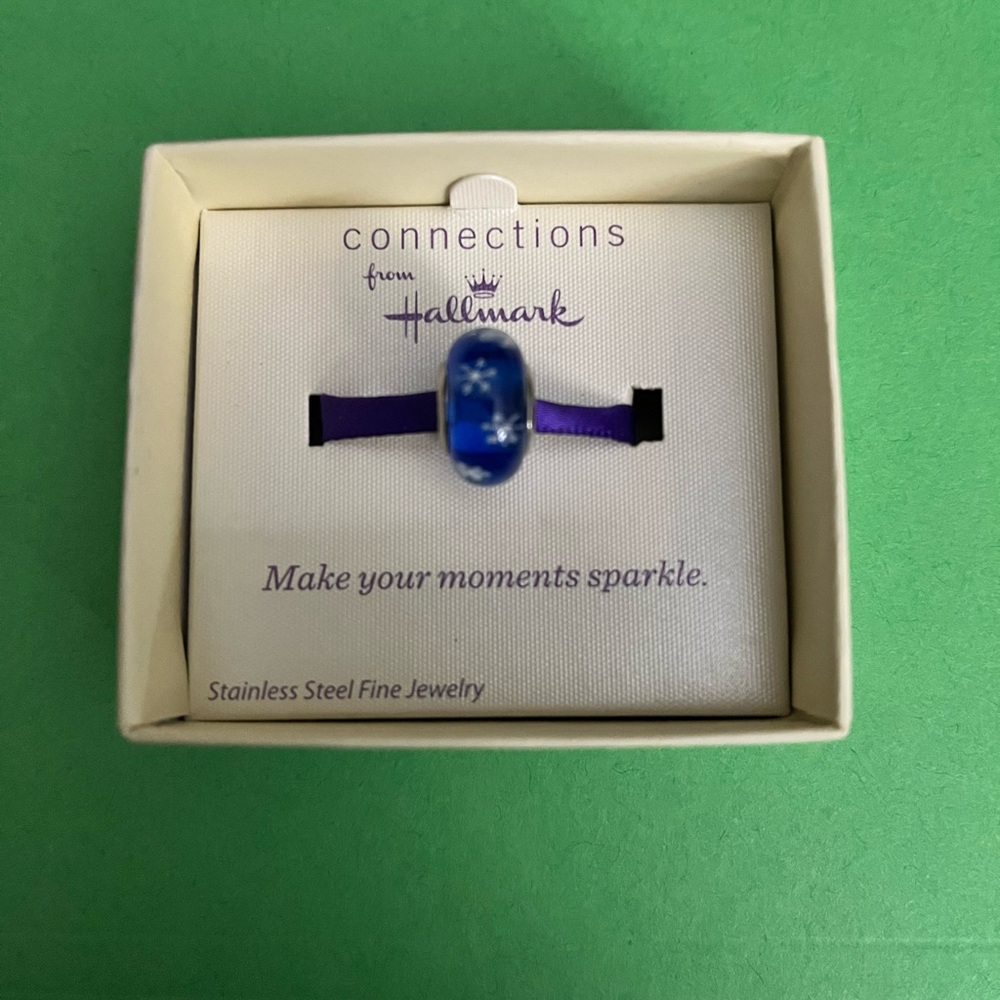 Hallmark Connections. Beautiful blue with white snow flakes charm.